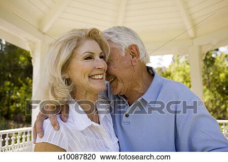 Mature couple in park View Large Photo Image Stock Image - Mature couple in park. Fotosearch