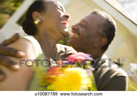 Mature couple with flowers View Large Photo Image Stock Photo - Mature couple with flowers. Fotosearch