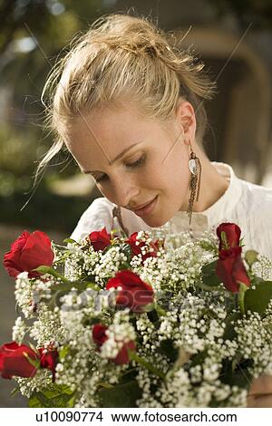 Woman with flowers View Large Photo Image Picture - Woman with flowers. Fotosearch