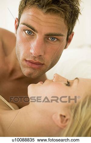 Young couple in bedroom View Large Photo Image Stock Photography - Young couple in bedroom. Fotosearch