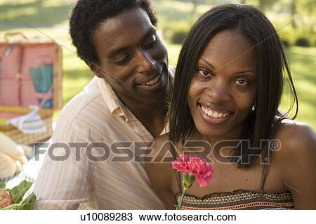 Young couple in park View Large Photo Image Stock Image - Young couple in park. Fotosearch