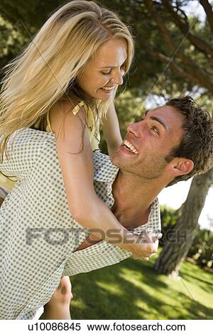 Stock Photography - Young couple in park. Fotosearch