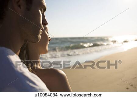 Picture - Couple on beach. Fotosearch