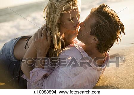 Picture - Couple on beach. Fotosearch
