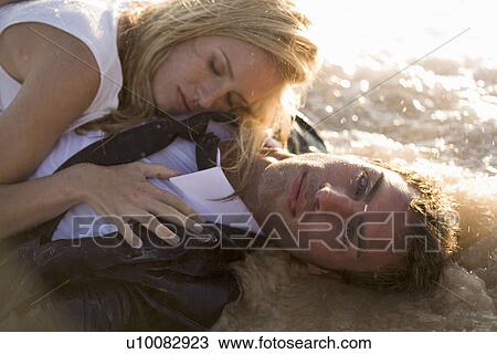 Couple on beach View Large Photo Image Stock Image - Couple on beach. Fotosearch