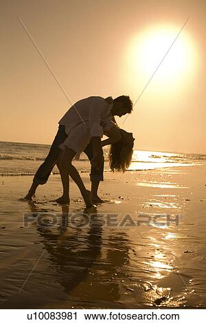 Couple on beach View Large Photo Image Stock Image - Couple on beach. Fotosearch
