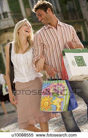 Couple with gift bags View Large Photo Image Stock Photography - Couple with gift bags. Fotosearch