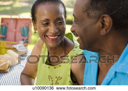 Mature couple in park View Large Photo Image Stock Photograph - Mature couple in park. Fotosearch