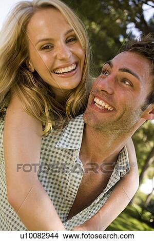 Young couple in park View Large Photo Image Picture - Young couple in park. Fotosearch