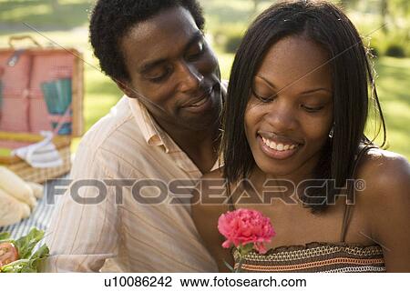 Young couple in park View Large Photo Image Stock Image - Young couple in park. Fotosearch