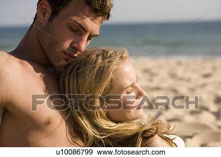 Young couple on beach View Large Photo Image Stock Photo - Young couple on beach. Fotosearch