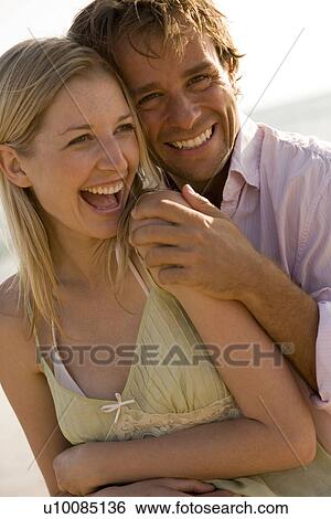 Young couple on beach View Large Photo Image Stock Photograph - Young couple on beach. Fotosearch