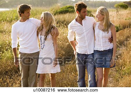 Young couples  View Large Photo Image Stock Photograph - Young couples . Fotosearch