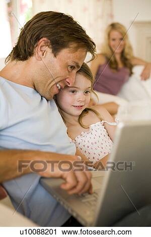 Stock Image - Family at home. Fotosearch