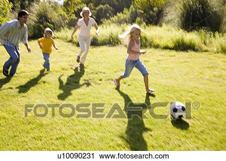 Stock Image - Family in park. Fotosearch