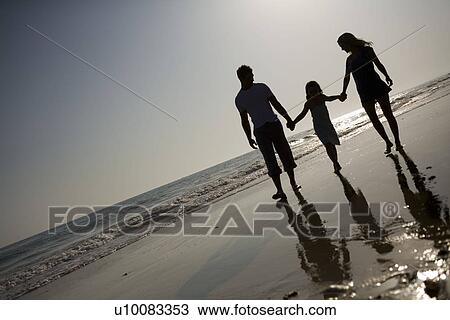 Family on beach walking together View Large Photo Image Stock Image - Family on beach walking together. Fotosearch