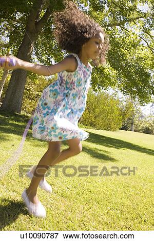 Girl skipping rope View Large Photo Image Stock Photo - Girl skipping rope. Fotosearch