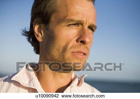Stock Image - Man on beach. Fotosearch