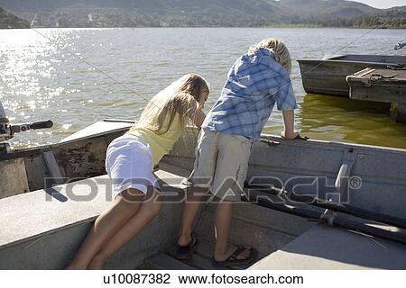 Two children in boat View Large Photo Image Stock Image - Two children in boat. Fotosearch