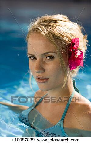 Stock Photo - Woman by pool. Fotosearch