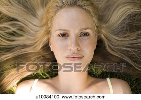 Stock Image - Woman laying down. Fotosearch