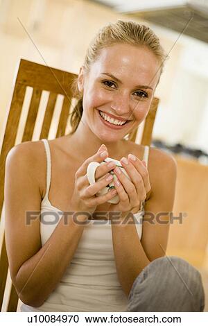 Stock Image - Woman with drink. Fotosearch