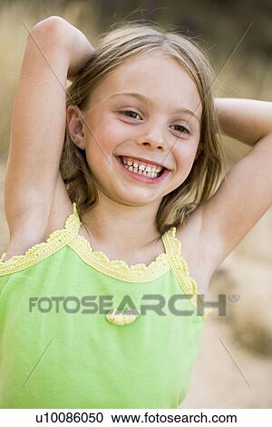 Young girl in park View Large Photo Image Stock Image - Young girl in park. Fotosearch
