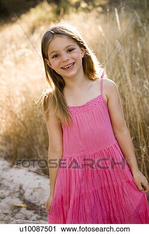 Stock Image - Young girl in park. Fotosearch