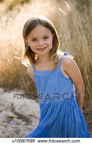 Stock Photo - Young girl in park. Fotosearch