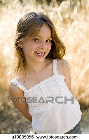 Stock Photograph - Young girl in park. Fotosearch