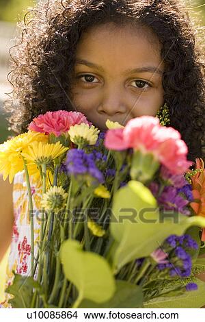 Young girl with flowers View Large Photo Image Picture - Young girl with flowers. Fotosearch