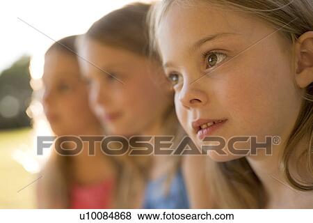Stock Photo - Young girls in park. Fotosearch
