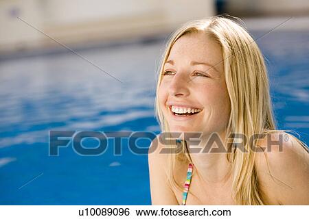 Young woman in swimming pool View Large Photo Image Stock Photograph - Young woman in swimming pool. Fotosearch