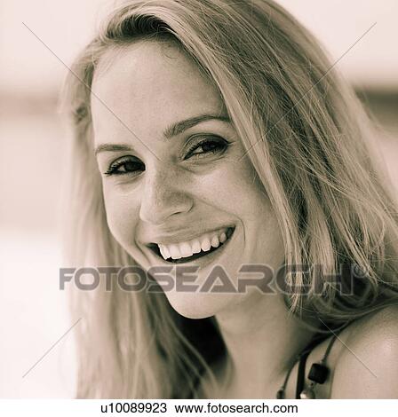 Stock Image - Black and white portrait of smiling woman. Fotosearch