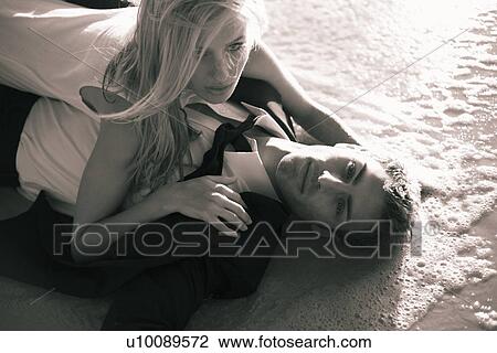 Stock Image - Couple on beach. Fotosearch