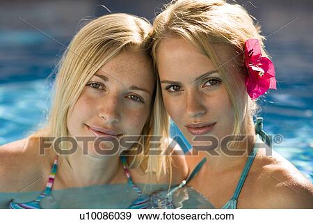 Stock Photo - Two women in pool. Fotosearch