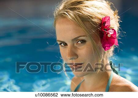 Stock Image - Woman by pool. Fotosearch