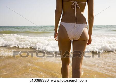Stock Image - Woman on beach. Fotosearch