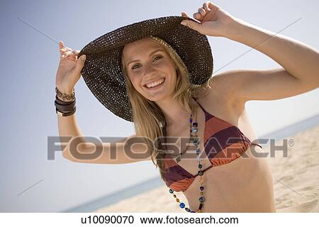 Stock Image - Woman on beach. Fotosearch