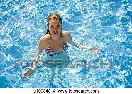 Woman swimming in pool View Large Photo Image Picture - Woman swimming in pool. Fotosearch