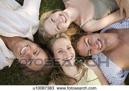 Young couples in park View Large Photo Image Stock Image - Young couples in park. Fotosearch