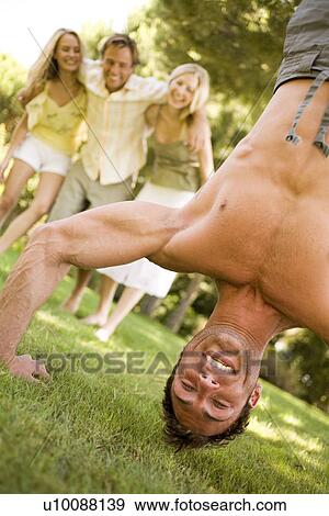 Stock Photo - Young couples in park. Fotosearch