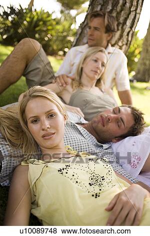 Stock Photo - Young couples in park. Fotosearch