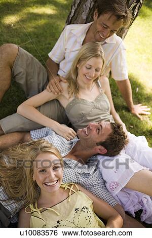 Young couples in park View Large Photo Image Stock Photograph - Young couples in park. Fotosearch