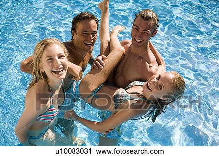Young couples in pool View Large Photo Image Stock Image - Young couples in pool. Fotosearch
