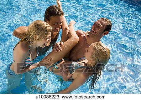 Young couples in pool View Large Photo Image Stock Image - Young couples in pool. Fotosearch
