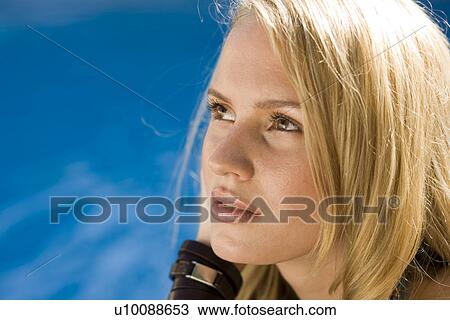 Stock Image - Young Woman in Swimming Pool. Fotosearch