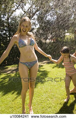Family at home playing in garden View Large Photo Image Stock Image - Family at home playing in garden. Fotosearch