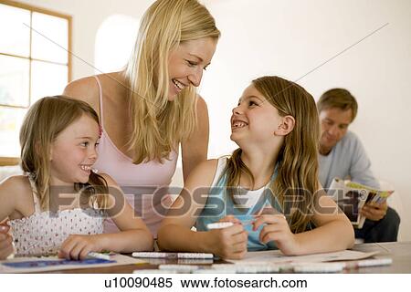 Stock Photography - Family at home. Fotosearch
