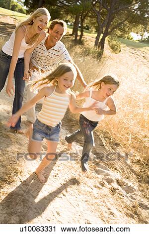 Stock Image - Family in park. Fotosearch